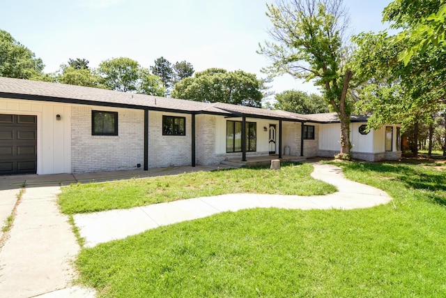 2911 US Highway 385, Littlefield, TX 79339 - ranch-style house featuring a garage and a front yard