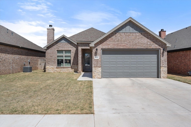 5908 Grinnell St, Lubbock, TX 79416 - view of front facade featuring concrete driveway, a garage, a front lawn, brick siding, and board and batten siding