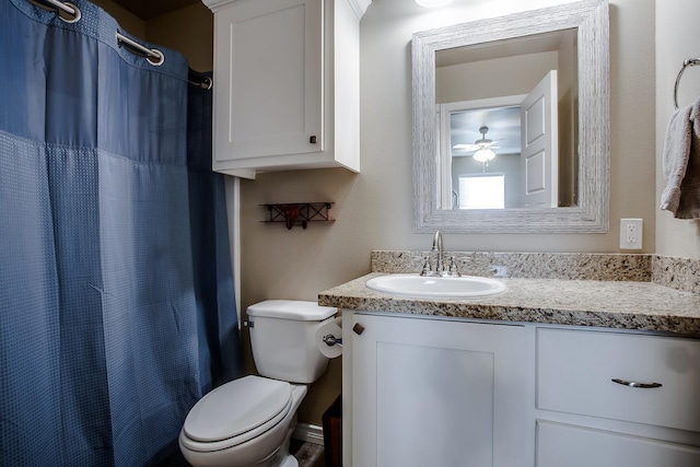 bathroom with vanity, toilet, and walk in shower