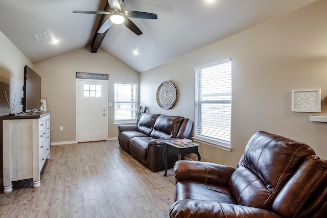 living room featuring light hardwood / wood-style flooring, lofted ceiling with beams, and ceiling fan