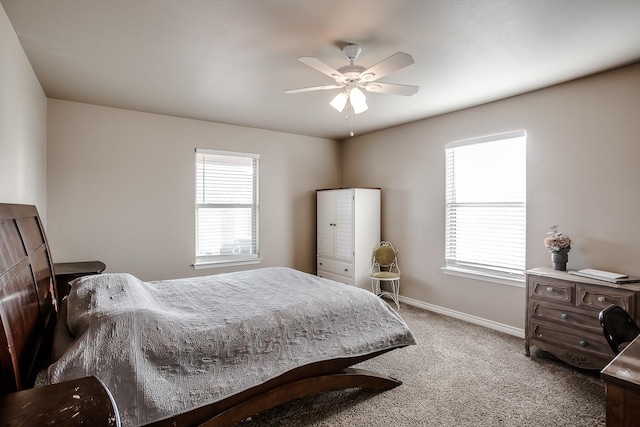 bedroom featuring multiple windows, carpet flooring, and ceiling fan