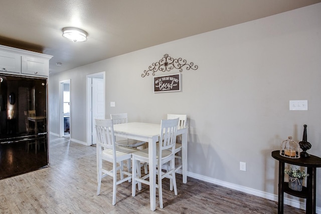 dining room featuring wood-type flooring