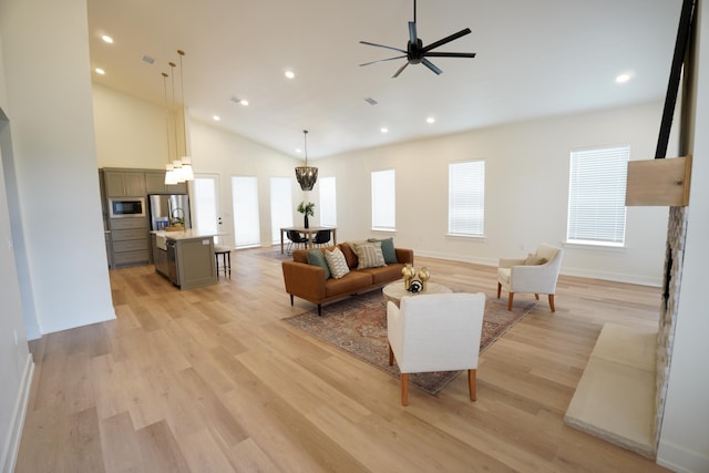 3628 119th St, Lubbock, TX 79423 - living area with plenty of natural light, vaulted ceiling, recessed lighting, light wood finished floors, and a ceiling fan