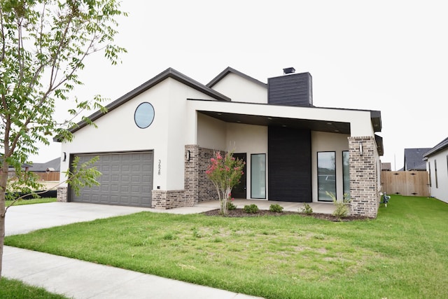 3628 119th St, Lubbock, TX 79423 - view of front of home with brick siding, stucco siding, a chimney, driveway, and an attached garage