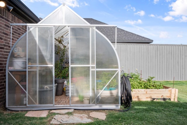 view of outdoor structure featuring a yard