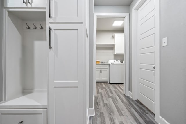 mudroom with washer / clothes dryer and light wood-type flooring