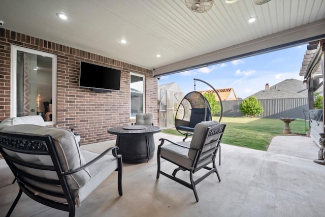 view of patio / terrace featuring ceiling fan