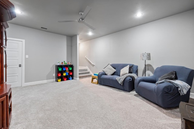 playroom featuring light colored carpet and ceiling fan