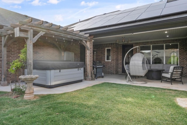 exterior space with a hot tub, a patio, and a pergola