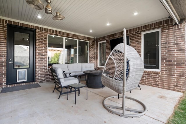 view of patio / terrace with an outdoor living space and ceiling fan