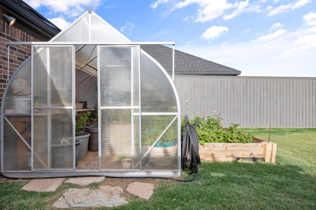 view of outdoor structure featuring a yard