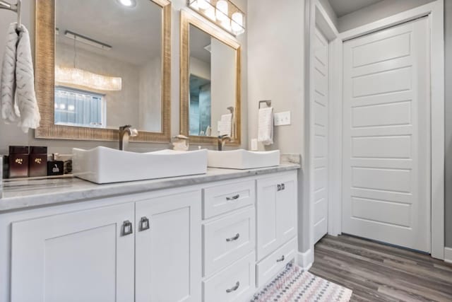 bathroom featuring vanity and hardwood / wood-style flooring