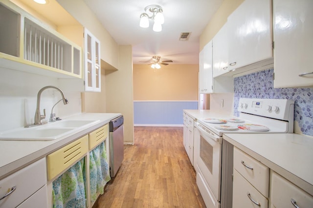 kitchen featuring sink, ceiling fan, dishwasher, white range with electric cooktop, and white cabinets