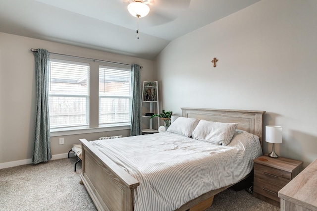 bedroom with ceiling fan, light colored carpet, and lofted ceiling