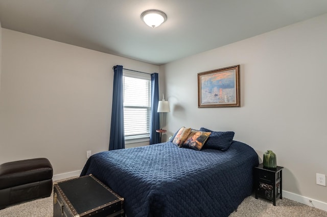 bedroom with light colored carpet