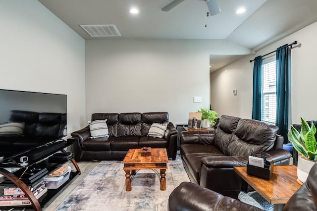 living room featuring ceiling fan and vaulted ceiling