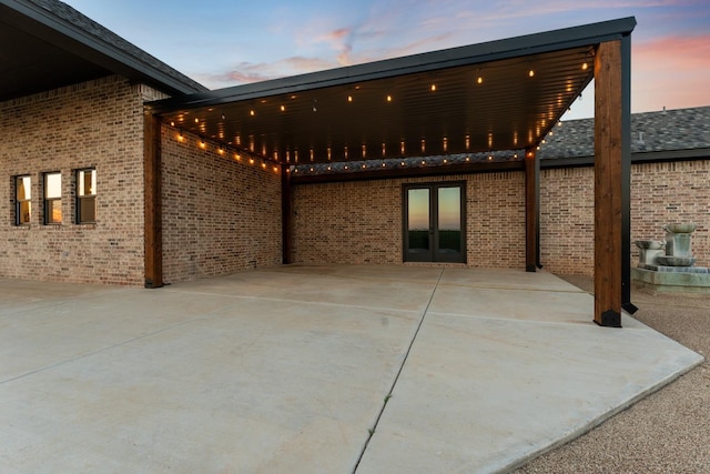 view of patio terrace at dusk