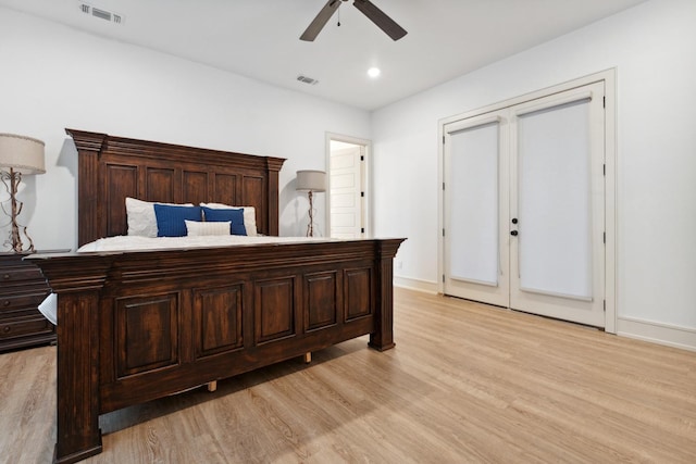 bedroom with ceiling fan and light wood-type flooring