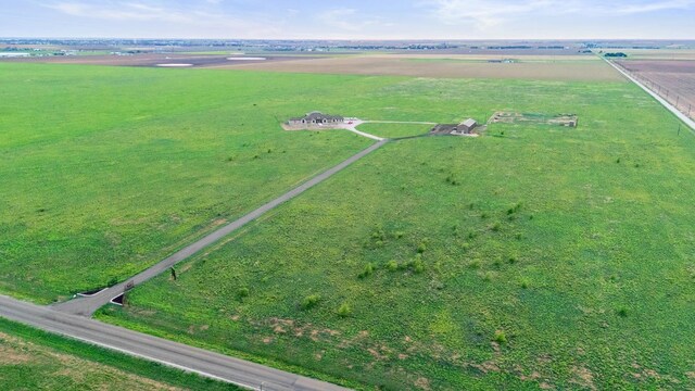 birds eye view of property with a rural view