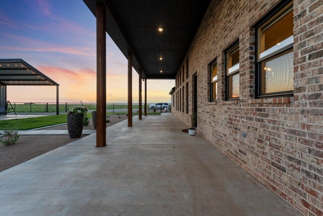 view of patio terrace at dusk