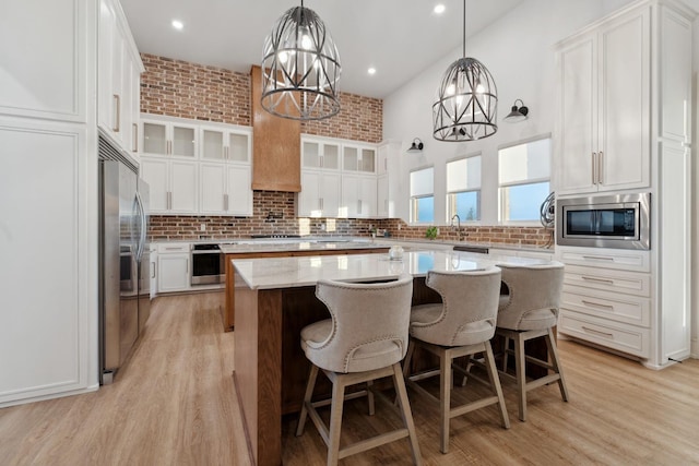 kitchen featuring a center island, white cabinets, and appliances with stainless steel finishes