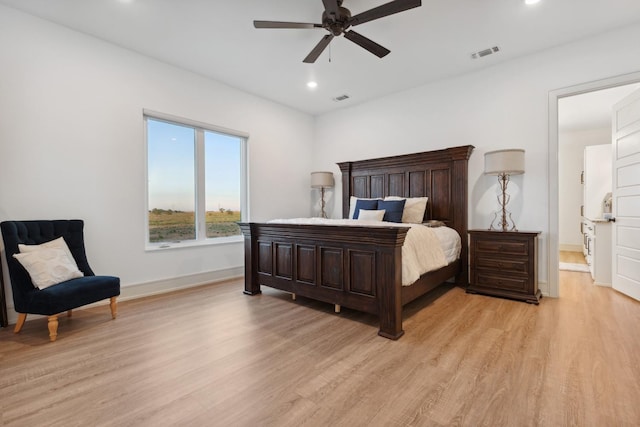 bedroom with ceiling fan and light hardwood / wood-style flooring