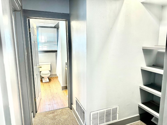 corridor featuring light hardwood / wood-style floors