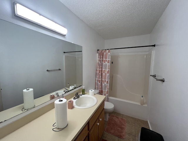 full bathroom with tile patterned floors, shower / bath combo with shower curtain, toilet, a textured ceiling, and vanity