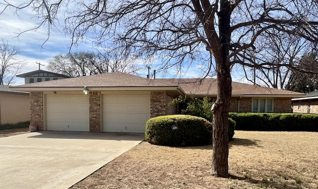 5013 57th St, Lubbock, TX 79414 - ranch-style house featuring brick siding, driveway, and an attached garage