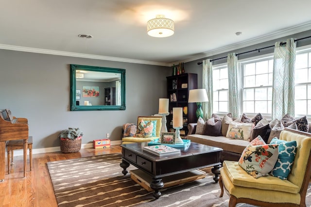 sitting room featuring crown molding and hardwood / wood-style flooring