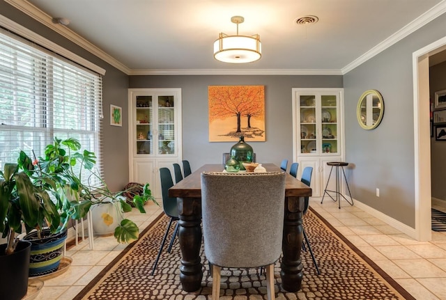 tiled dining area with ornamental molding