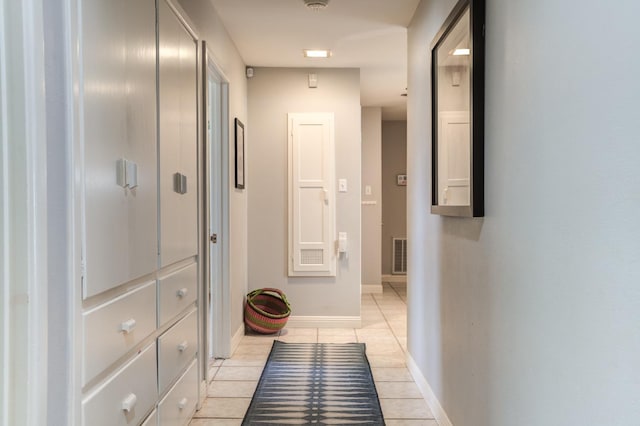 hallway featuring light tile patterned flooring