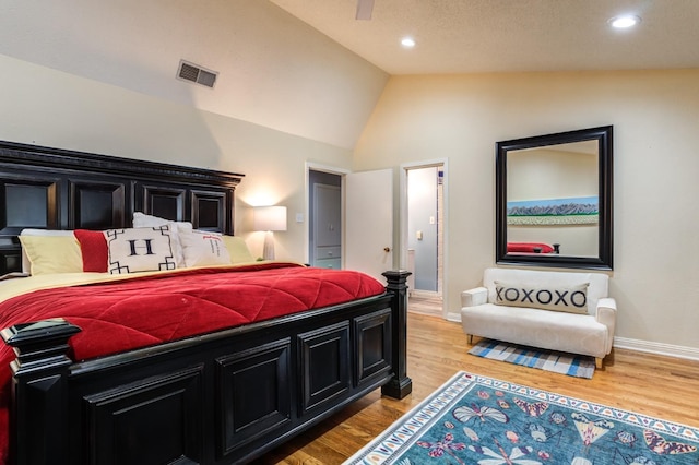 bedroom featuring vaulted ceiling and hardwood / wood-style floors