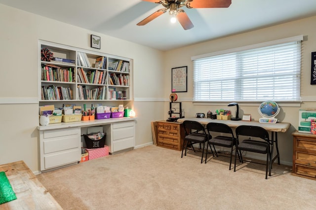 home office with light colored carpet and ceiling fan