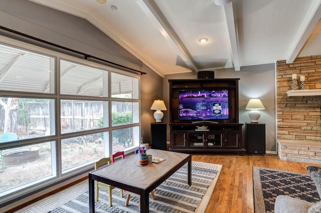 living room featuring lofted ceiling with beams and hardwood / wood-style flooring