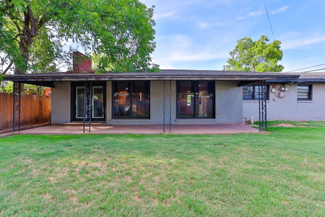 back of house featuring a yard and a patio area