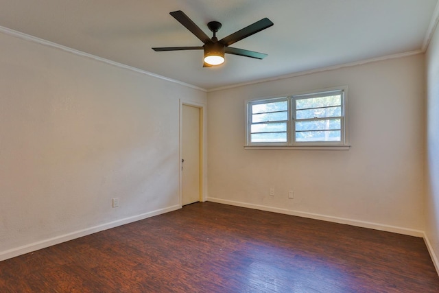 empty room featuring dark hardwood / wood-style flooring, crown molding, and ceiling fan