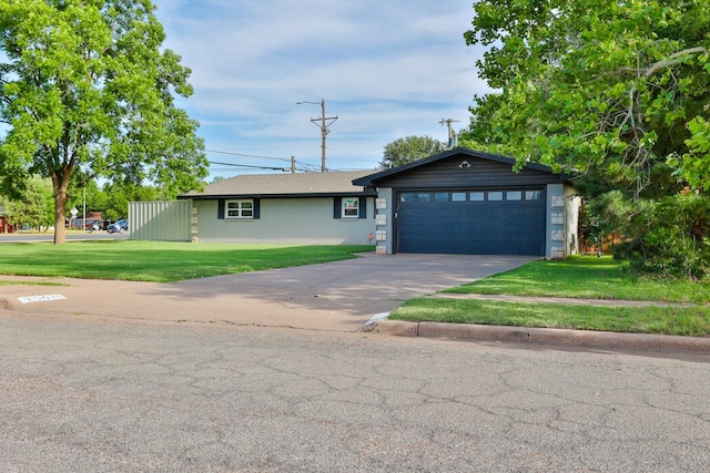 view of front facade featuring a garage and a front yard