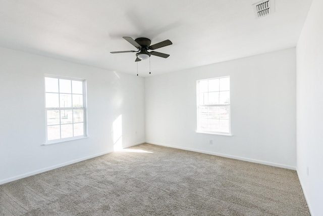 carpeted empty room with ceiling fan