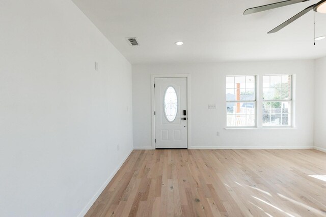 foyer entrance with light hardwood / wood-style floors and ceiling fan