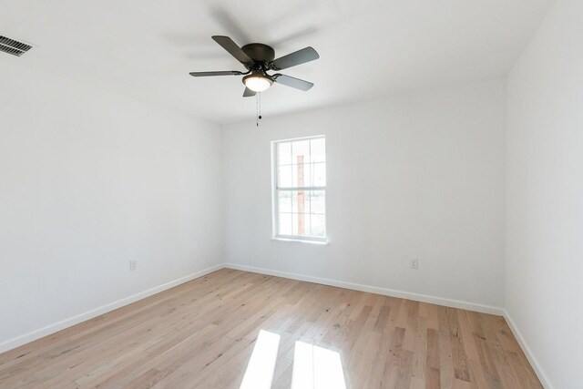 unfurnished room with ceiling fan and light hardwood / wood-style flooring