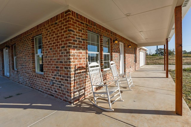 view of patio featuring a garage