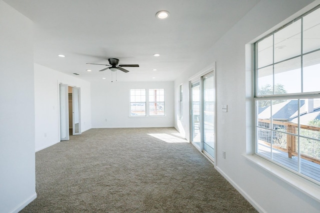 empty room with carpet floors and ceiling fan