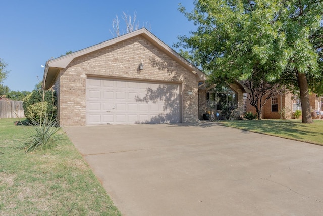 view of front of house with a garage and a front yard