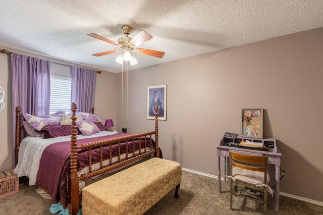 carpeted bedroom featuring ceiling fan and a textured ceiling