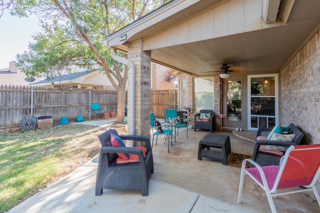 view of patio / terrace with an outdoor living space and ceiling fan