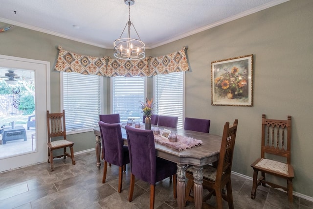 dining room featuring crown molding and a chandelier