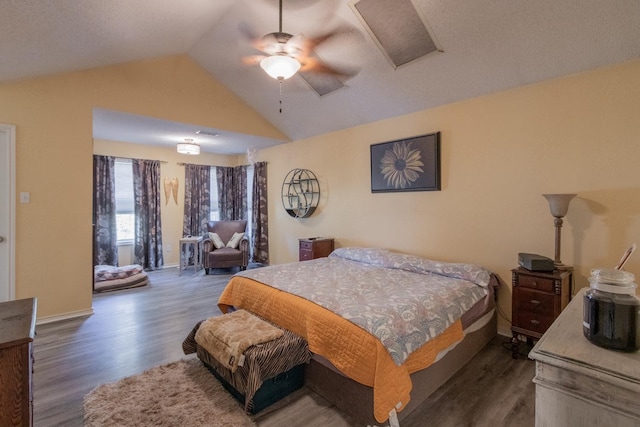 bedroom featuring dark wood-type flooring, ceiling fan, and vaulted ceiling