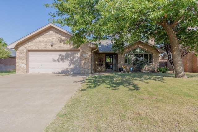 single story home with a garage and a front lawn