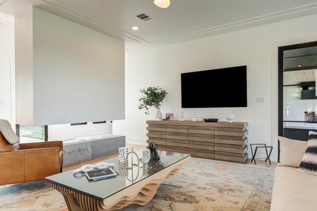 interior space featuring light stone countertops, light hardwood / wood-style floors, and high end stainless steel range oven